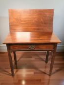 A reproduction mahogany turnover top table fitted a drawer, width 78 cm.
