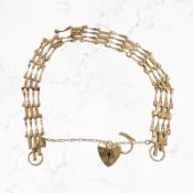 A 9ct gold padlock bracelet CONDITION REPORT: 4.