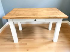 A painted farmhouse style kitchen table fitted a drawer,