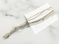 A group of silver and silver-gilt necklaces