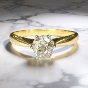A diamond solitaire ring, the old-cut stone weighing approximately 0.