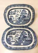 A pair of 19th century ironstone blue and white transfer willow pattern meat plates, width 45 cm.