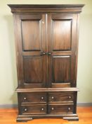 A stained hardwood double door wardrobe,