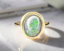 A 9ct gold opal ring, size L CONDITION REPORT: 2.