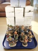 Ten Goebel figurines of boys and girls.