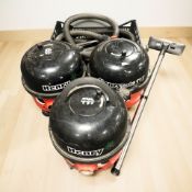 Three Henry vacuum cleaners.