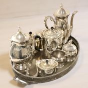 An EPNS twin handled serving tray containing tea wares.