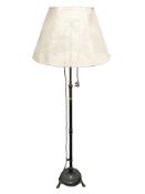 A brass standard lamp.