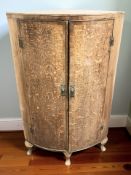 A George III oak bow-front double door corner cabinet,
