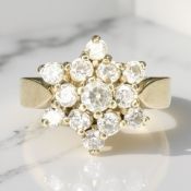 A 9ct gold moissanite cluster ring, size P½ CONDITION REPORT: 5.
