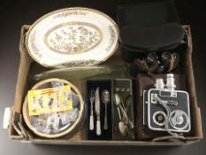A vintage cine camera, a pair of Soviet binoculars, together with a group of cutlery,