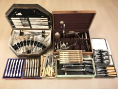 Several cutlery canteens and contents.