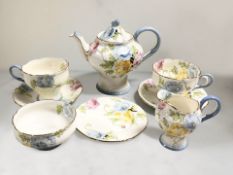 A Paragon tea for two, pattern 4793. CONDITION REPORT: One teacup with restored foot.