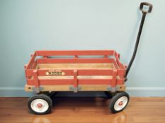 A wooden pull along cart marked Rodeo,