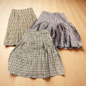 Three tartan skirts