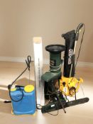 A Black and Decker garden shredder together with a leaf blower, Bosch trimmer, pole trimmer,