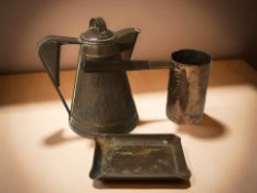 An Arts and Crafts copper water jug,
