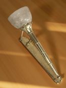 A brass and etched glass wall sconce, wired for electricity,