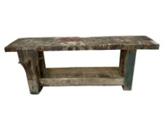 An early 20th century pine work bench fitted with a vice,