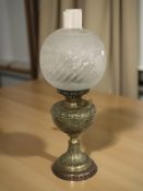 A brass Duplex oil lamp with frosted glass shade,
