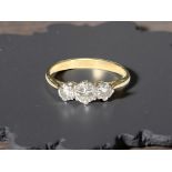 An 18ct yellow gold three stone diamond ring, size P. CONDITION REPORT: Weight: 2.9g.
