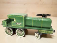 A vintage child's painted wooden ride on train,