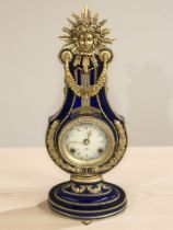 A decorative Victoria and Albert Museum replica 'Marie Antoinette' mantel clock with movement