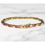 An 18ct gold ruby bracelet, length 18cm CONDITION REPORT: 12.