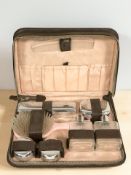 A Maylor London travelling vanity set in case