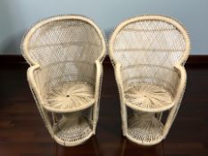 A pair of 20th century wicker peacock armchairs,