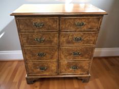 A reproduction yew wood side cabinet with dummy drawers to front,