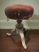 A Victorian mahogany revolving piano stool