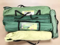 A group of folding camp beds