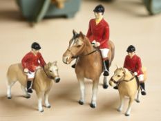 Three pottery figures of huntsmen on horseback,