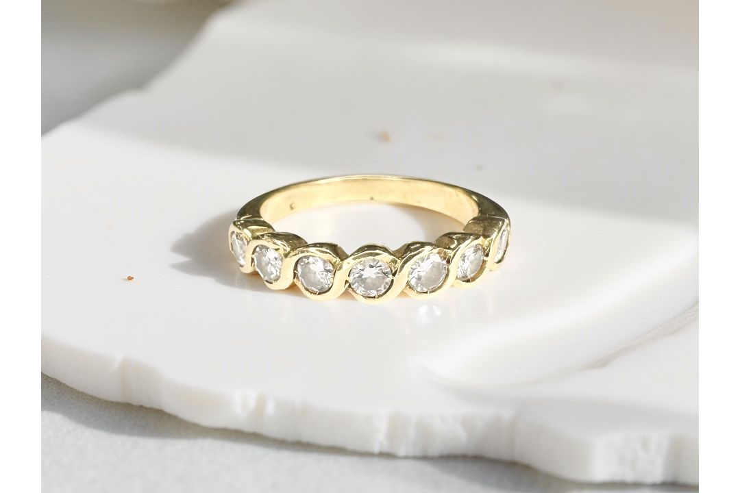 An 18ct gold diamond half eternity ring, approximately 0.45 carat.