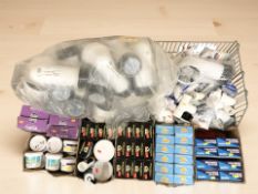 A large quantity of plumbing fittings, tile grout,