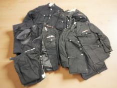 A group of police uniforms, tunics,