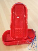 Twelve new plastic sledges