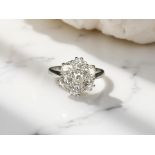 An 18ct white gold diamond cluster ring, approximately 1.