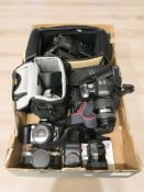 A group of cameras, Olympus E-500 8 megapixel camera, Canon EOS 500 and Pentax ME Super cameras,