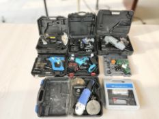 A group of boxed tools, Titan electric drill,