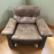 A 20th century Scandinavian stitched and buttoned brown leather Finnish armchair after Lepofinn,