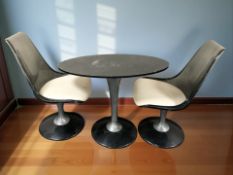 An oval table on aluminium and perspex support and a pair of matching chairs with cream vinyl seats