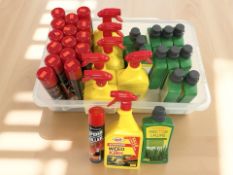 Several new bottles of lawn feed,