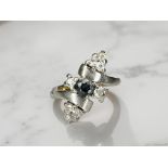 An unusual 18ct gold sapphire and diamond ring, size N CONDITION REPORT: 5.