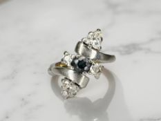 An unusual 18ct gold sapphire and diamond ring, size N CONDITION REPORT: 5.