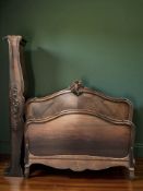 A 19th century French carved oak double bed frame
