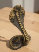A resin figure of a cobra,