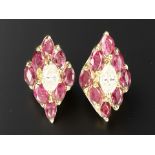 A fine quality pair of 18ct yellow gold ruby and diamond earrings.