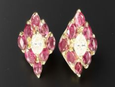 A fine quality pair of 18ct yellow gold ruby and diamond earrings.